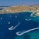 A catamaran drifts in the Aegean sea